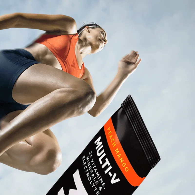 Athlete mid-leap with a Peach-Mango MULTI-V stick pack