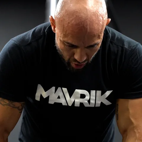Boxer wrapping his wrists in a MAVRIK tee